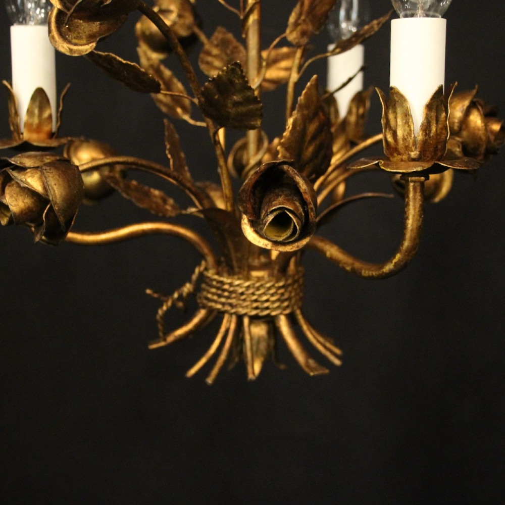 A French gilt metal triple-light chandelier styled with hand-formed metal rose blossoms, leaves, and a tied sheaf motif at the base. View IX