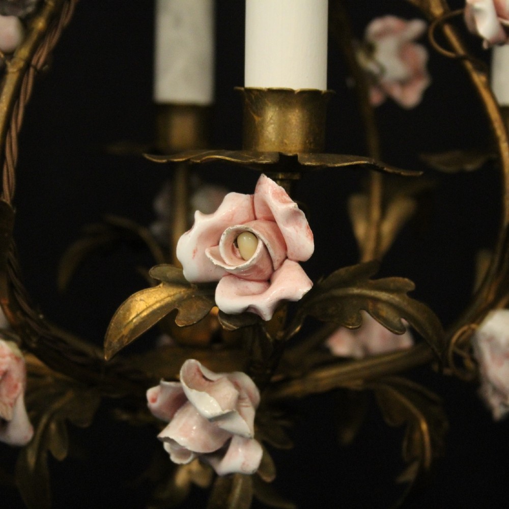 A four-light French toleware chandelier featuring gilded metal leaf branches adorned with small pink porcelain rose blossoms. View V
