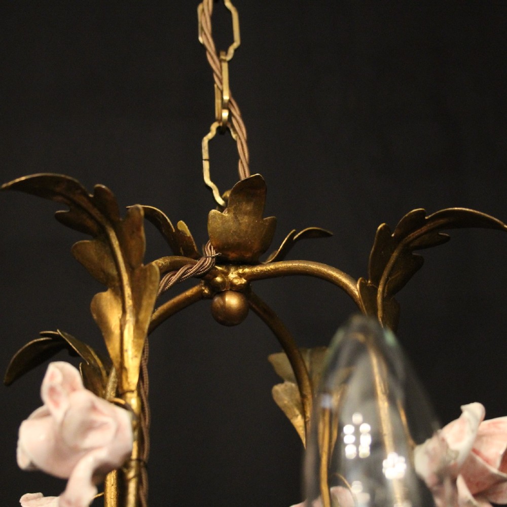 A four-light French toleware chandelier featuring gilded metal leaf branches adorned with small pink porcelain rose blossoms. View IX