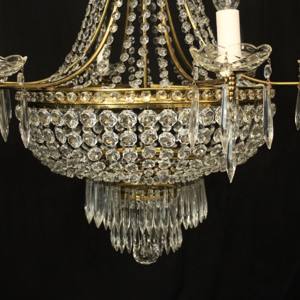 A French gilded brass nine-light chandelier featuring a cascading tent and waterfall structure adorned with faceted crystal beads and drops. View III