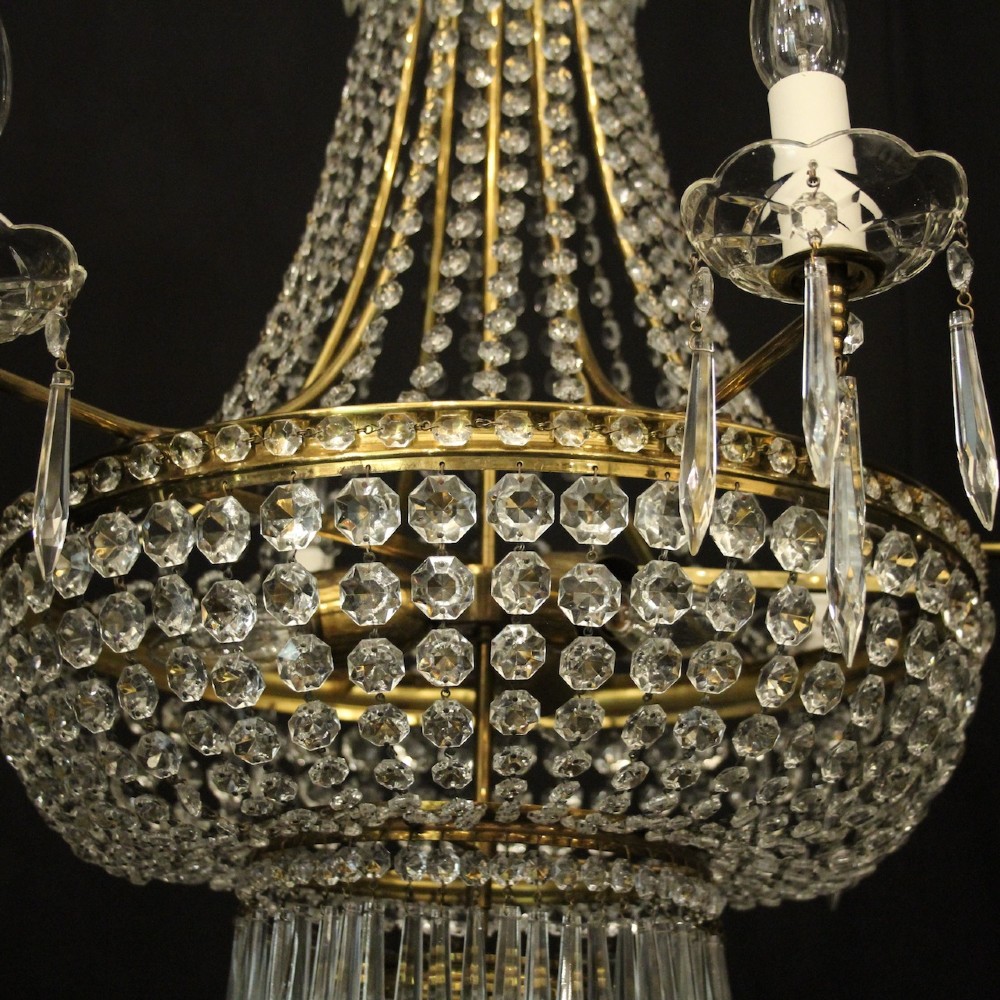 A French gilded brass nine-light chandelier featuring a cascading tent and waterfall structure adorned with faceted crystal beads and drops. View VII