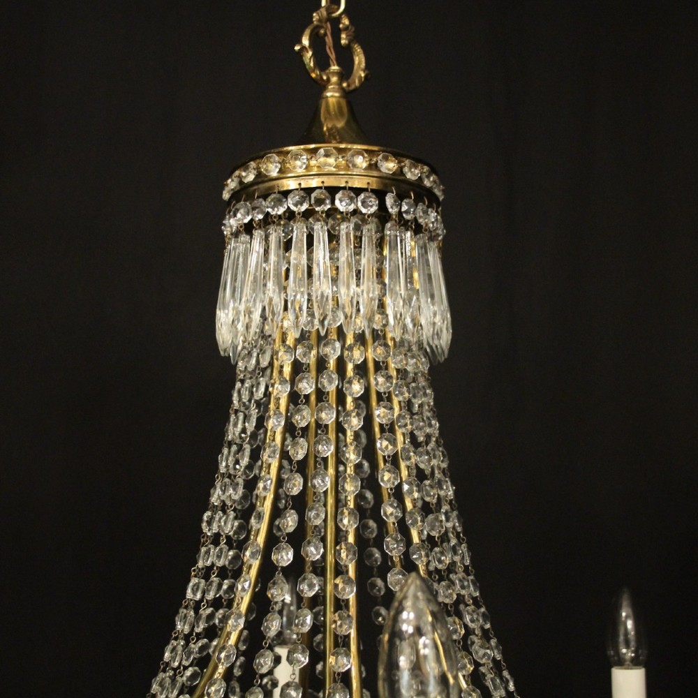 A French gilded brass nine-light chandelier featuring a cascading tent and waterfall structure adorned with faceted crystal beads and drops. View VIII
