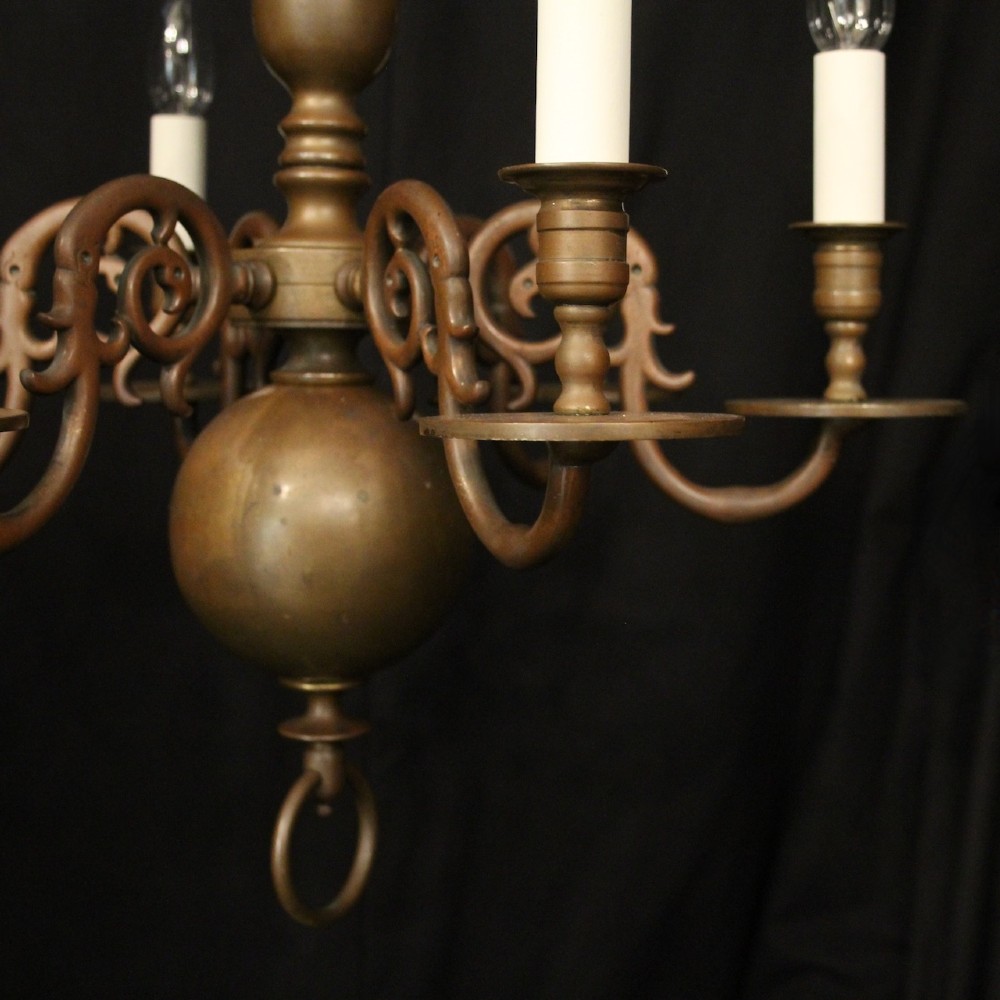 A pair of dark bronze six-light chandeliers featuring central turned baluster stems, lower spherical drops, and scrolling candle arms. View III
