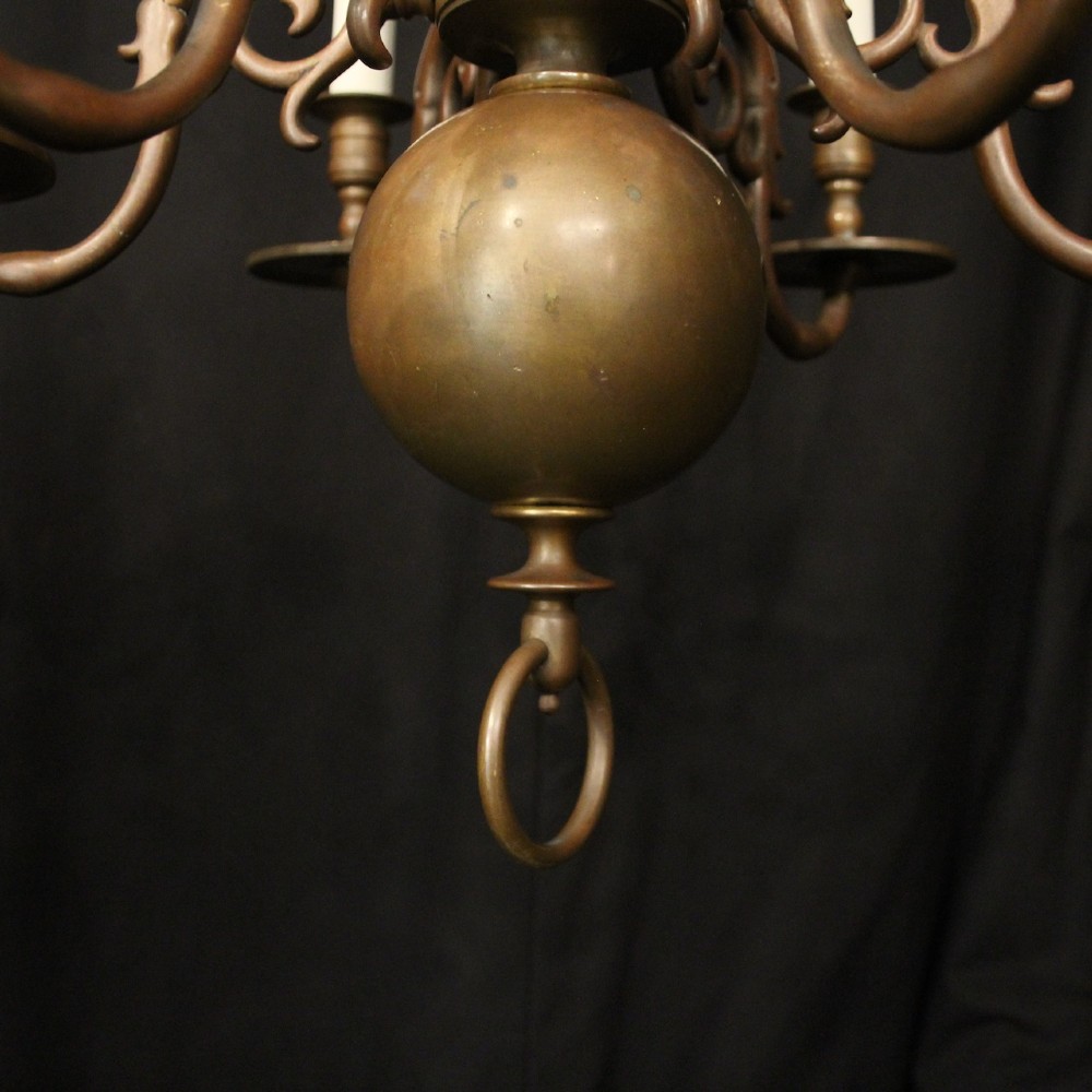 A pair of dark bronze six-light chandeliers featuring central turned baluster stems, lower spherical drops, and scrolling candle arms. View VII