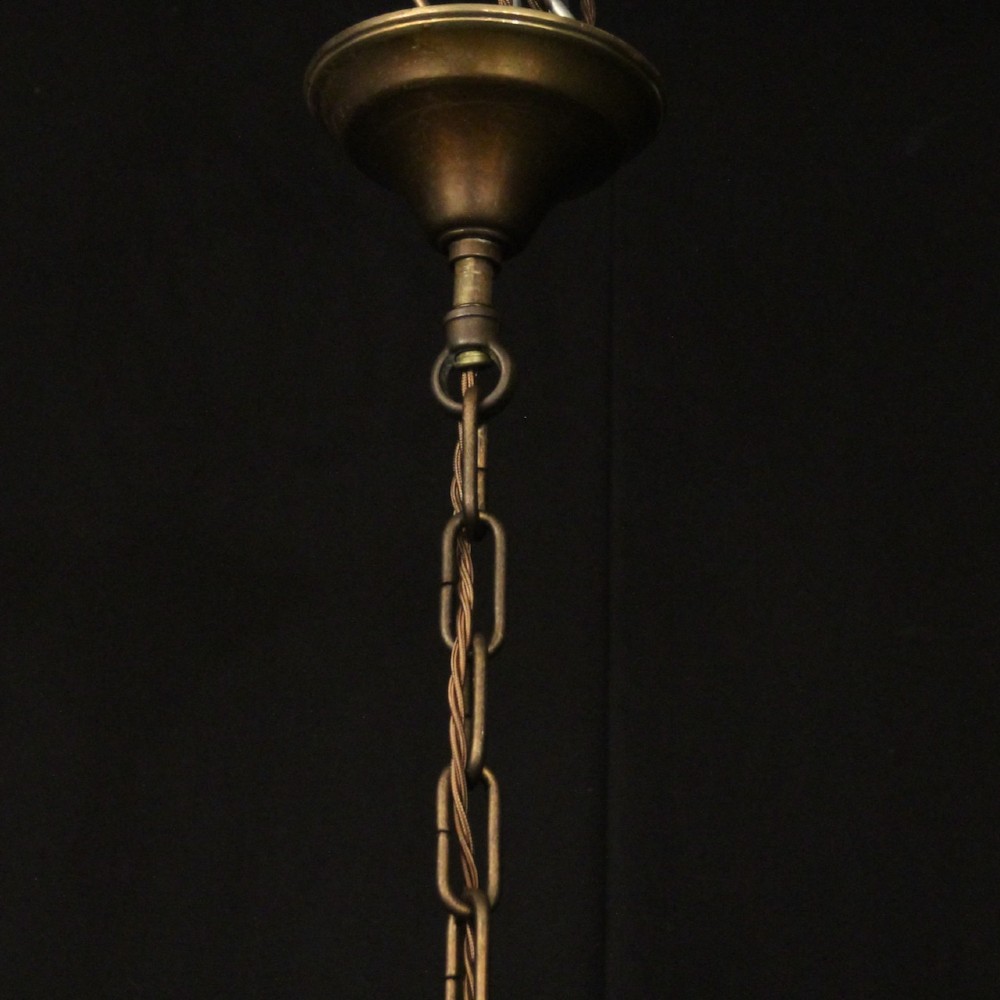 A pair of dark bronze six-light chandeliers featuring central turned baluster stems, lower spherical drops, and scrolling candle arms. View X