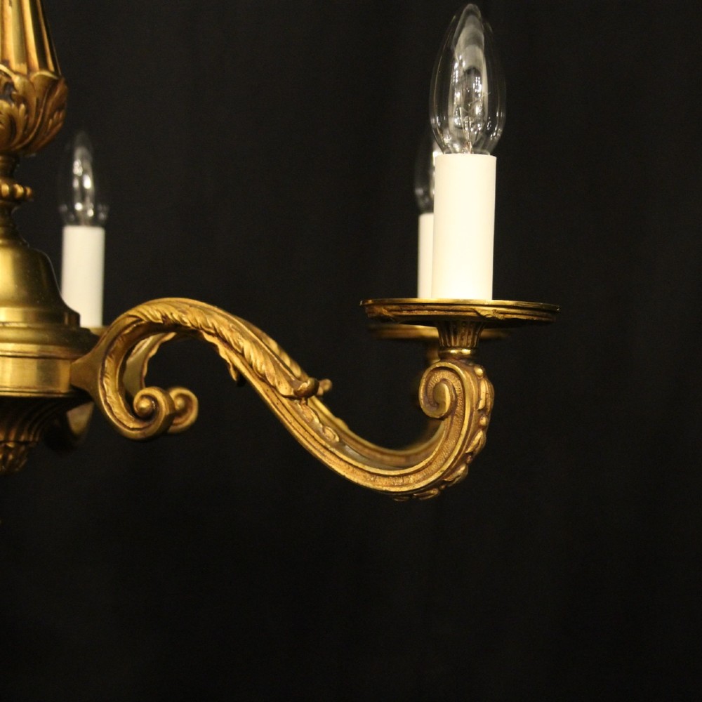 A French six-light chandelier constructed from gilded bronze featuring a fluted central column and scroll-form acanthus arms. View II
