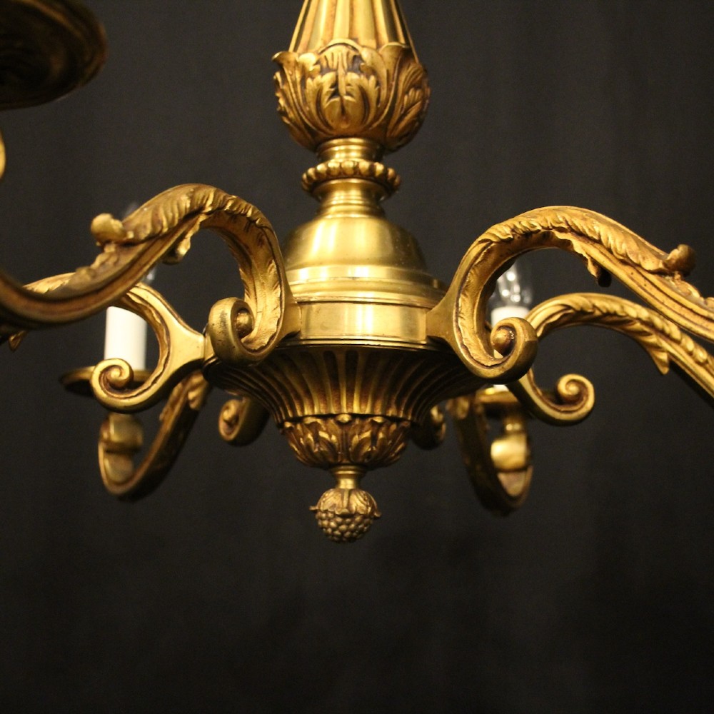 A French six-light chandelier constructed from gilded bronze featuring a fluted central column and scroll-form acanthus arms. View IV