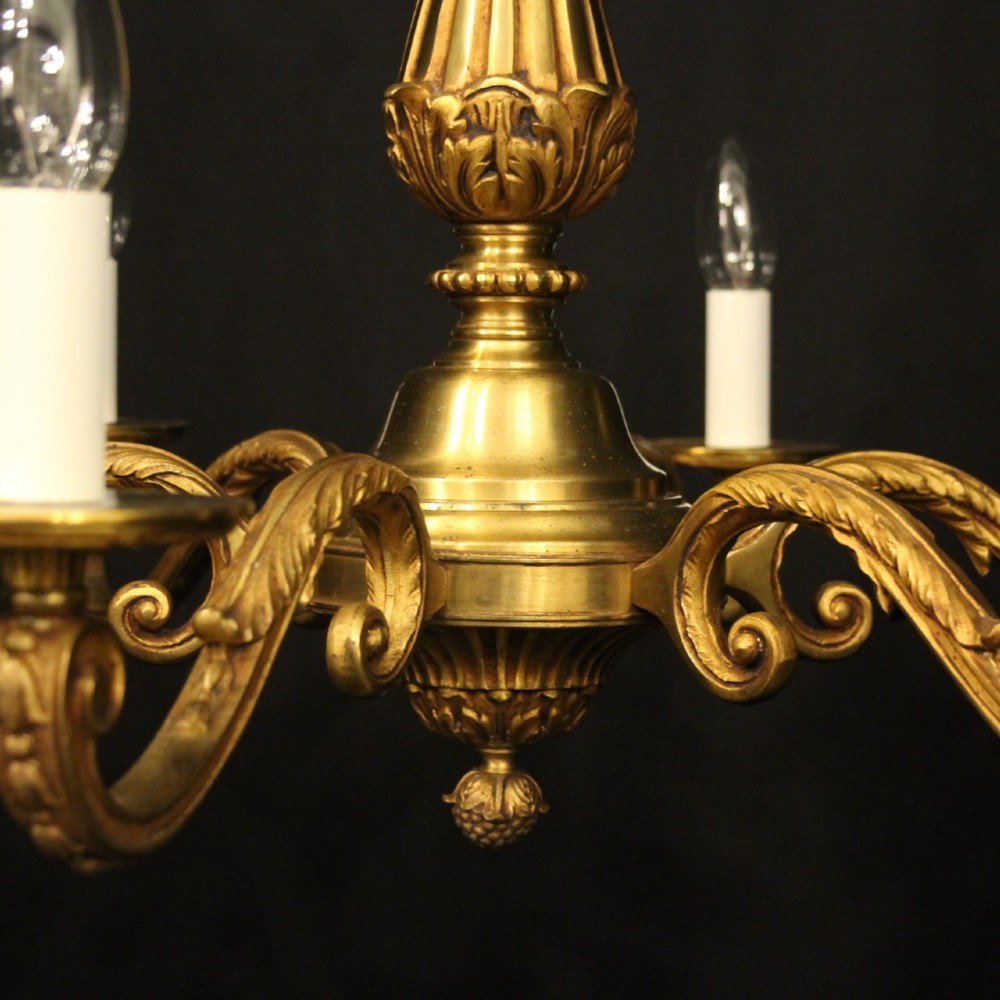A French six-light chandelier constructed from gilded bronze featuring a fluted central column and scroll-form acanthus arms. View VIII