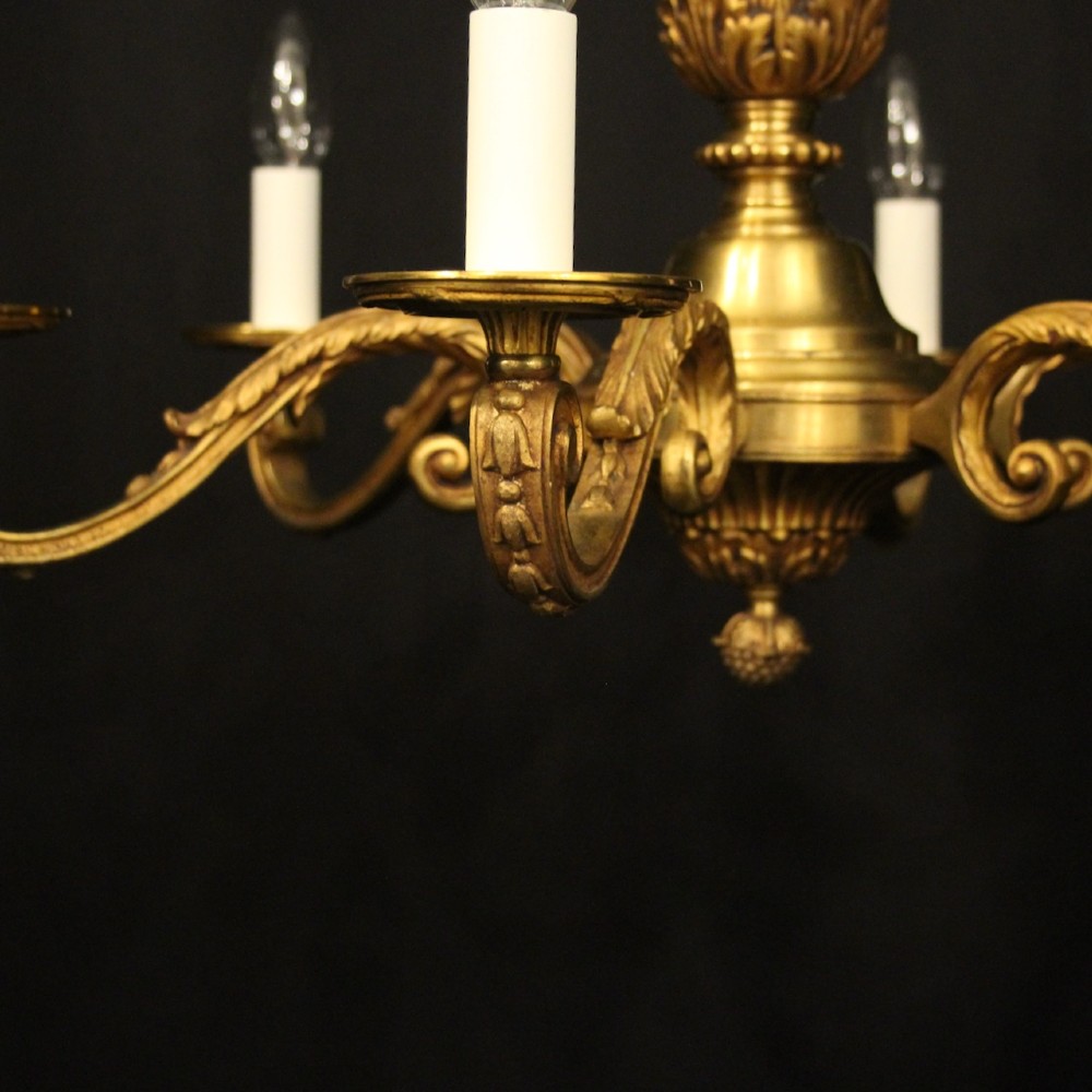 A French six-light chandelier constructed from gilded bronze featuring a fluted central column and scroll-form acanthus arms. View IX