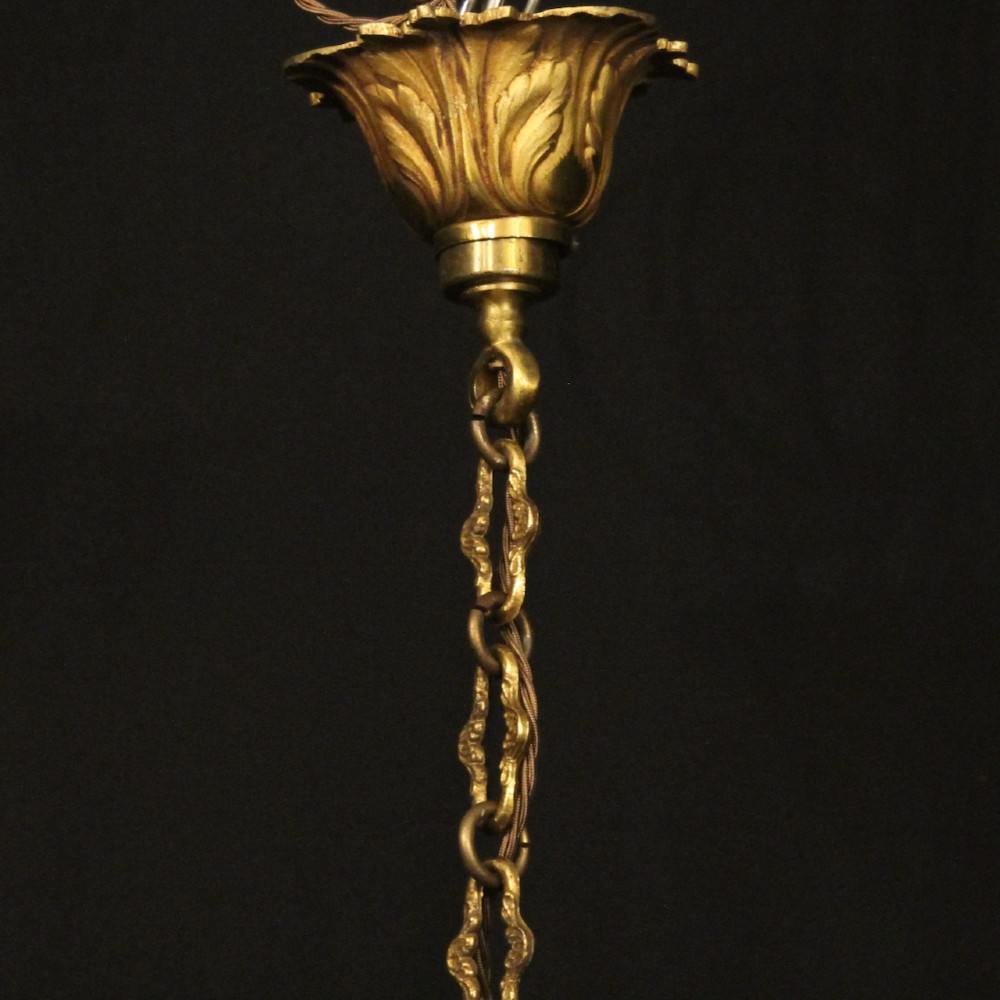 A French six-light chandelier constructed from gilded bronze featuring a fluted central column and scroll-form acanthus arms. View X