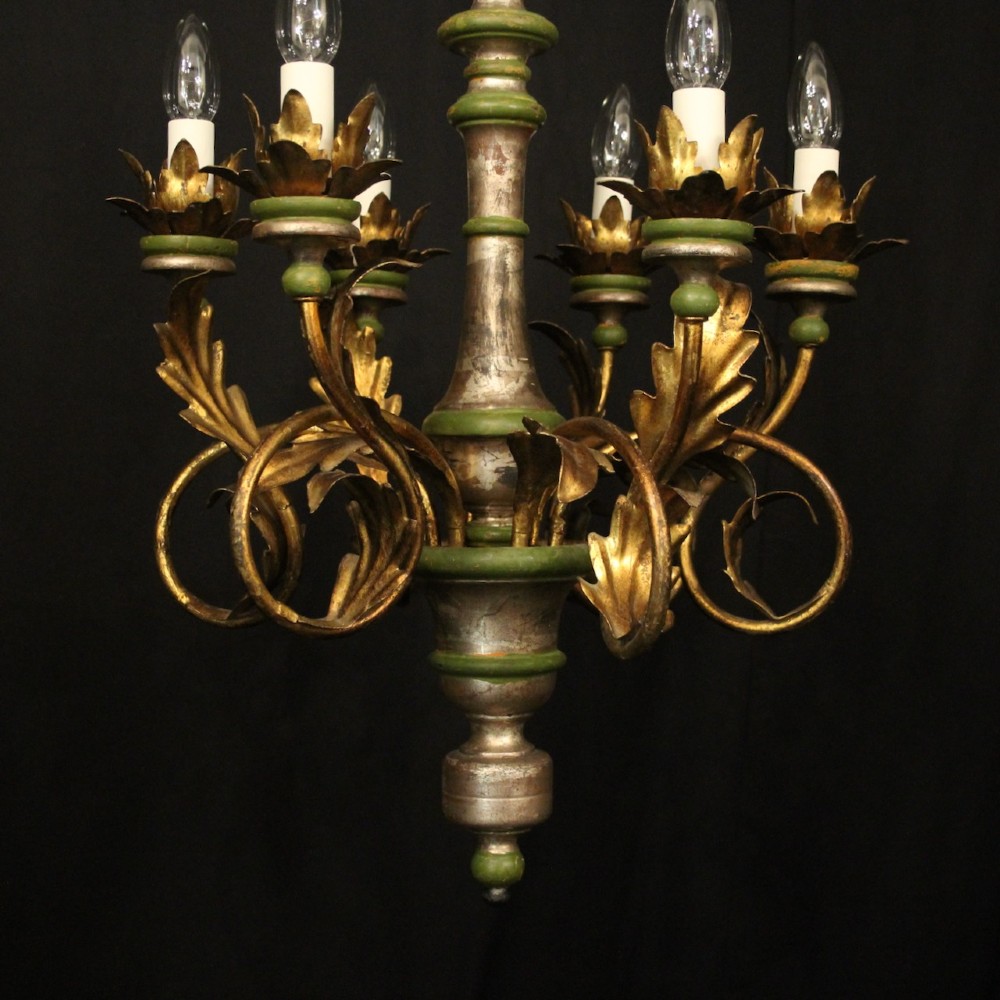 A Florentine six-arm giltwood chandelier featuring hand-carved acanthus leaves, turned central column, green painted accents, and distressed gold leaf finish. View II