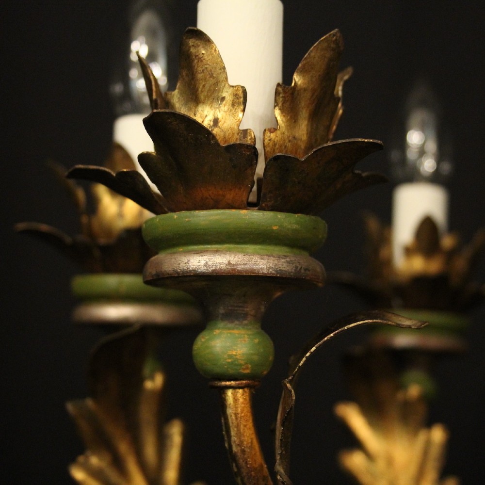 A Florentine six-arm giltwood chandelier featuring hand-carved acanthus leaves, turned central column, green painted accents, and distressed gold leaf finish. View VII