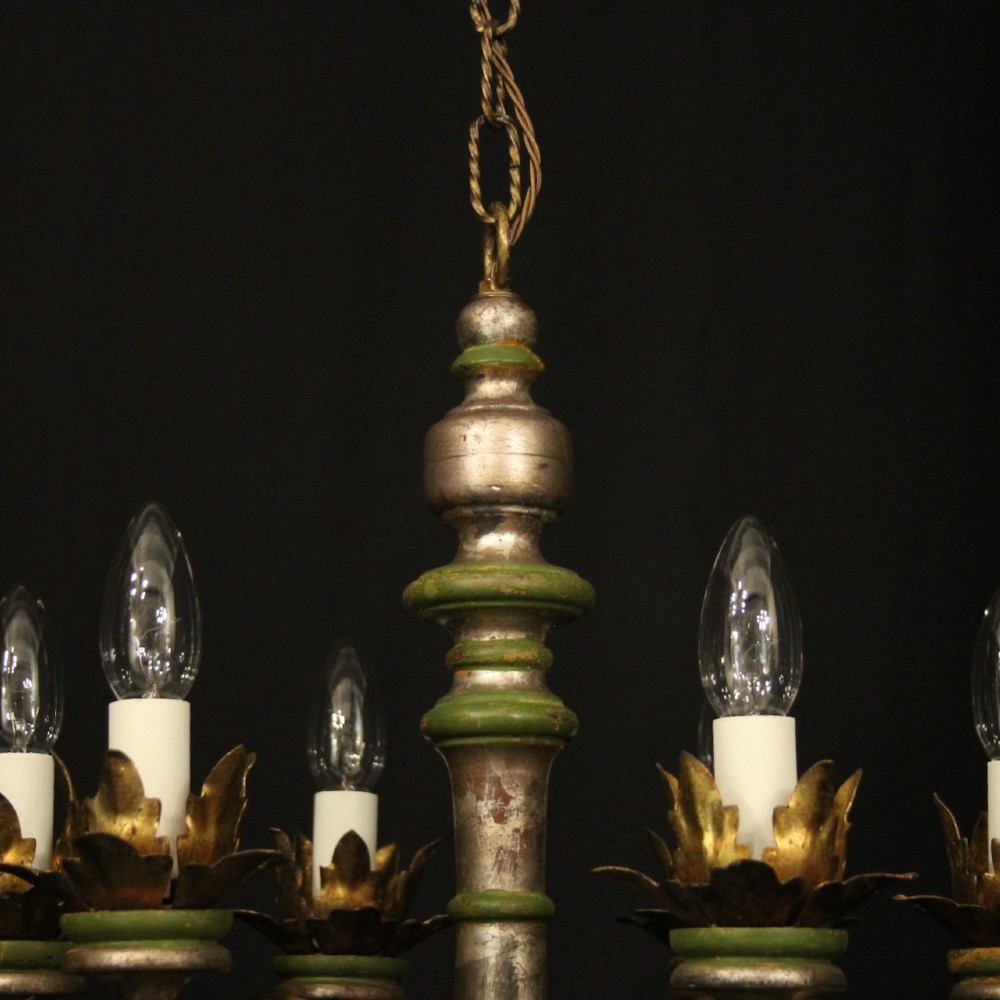 A Florentine six-arm giltwood chandelier featuring hand-carved acanthus leaves, turned central column, green painted accents, and distressed gold leaf finish. View IX