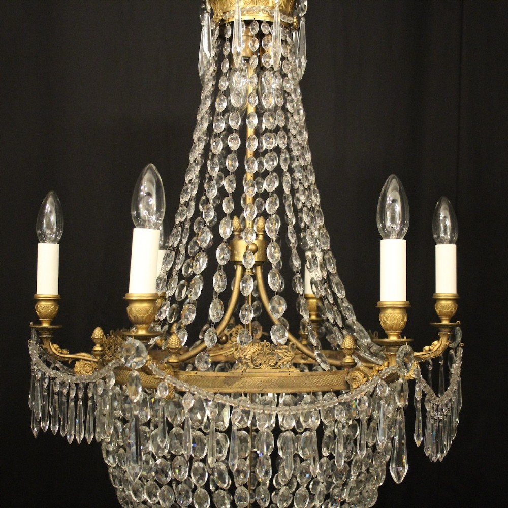 A 19th-century French gilt bronze tent and waterfall chandelier adorned with cascading crystal beads, candle sockets, and hanging glass prisms. View III