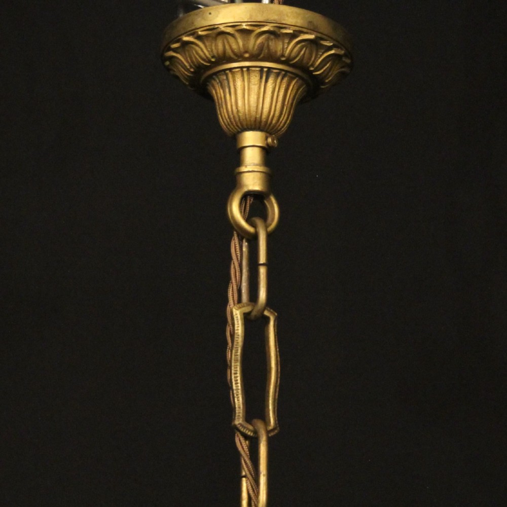 A 19th-century French gilt bronze tent and waterfall chandelier adorned with cascading crystal beads, candle sockets, and hanging glass prisms. View X