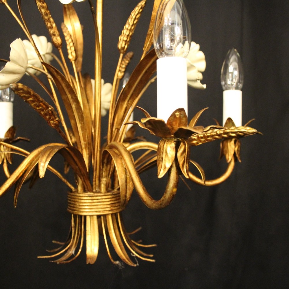 A French five-light gilded metal chandelier featuring a central wheatsheaf motif with cream painted flowers and candle-style bulb sockets. View IV
