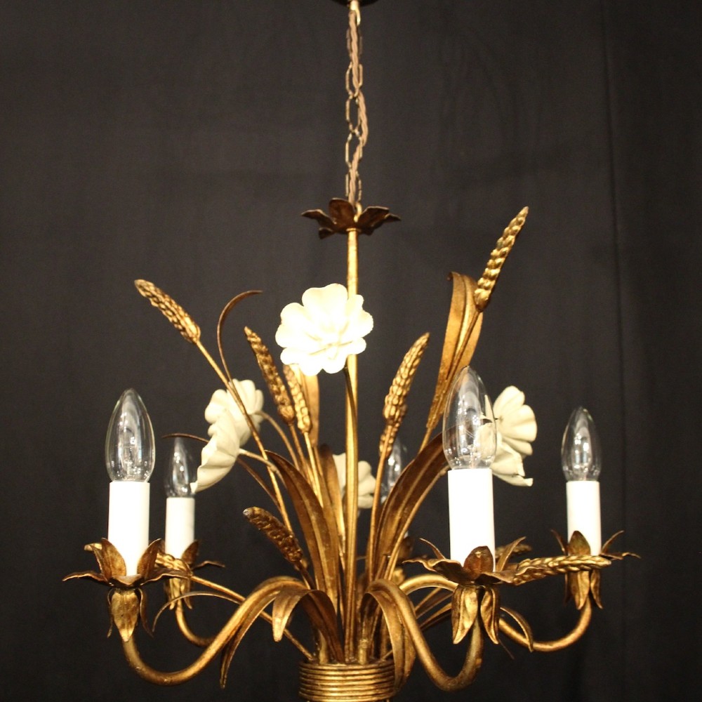 A French five-light gilded metal chandelier featuring a central wheatsheaf motif with cream painted flowers and candle-style bulb sockets. View VI