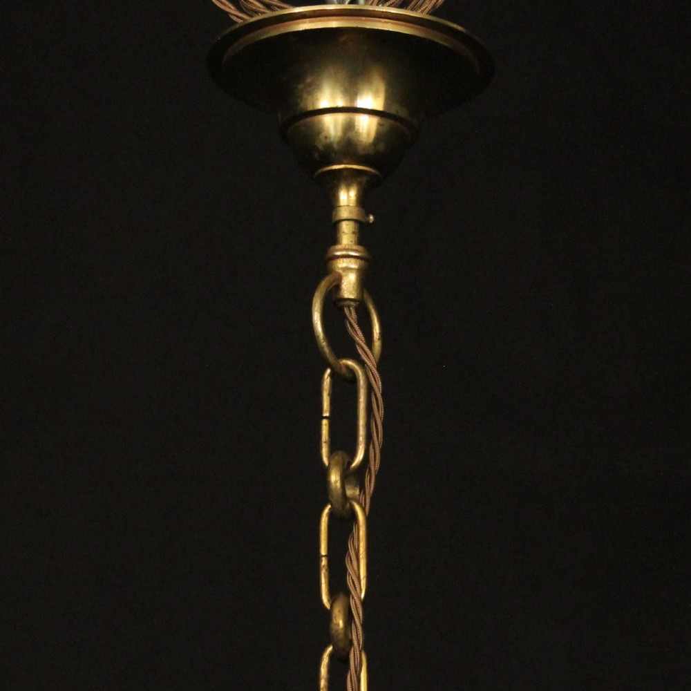 A cylindrical French gilded bronze hall lantern featuring curved glass panels and four internal candle-style light fittings. View X