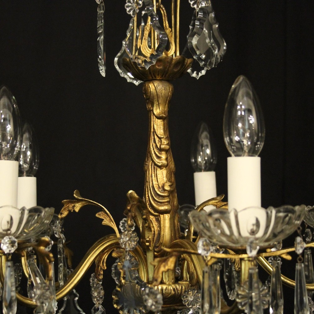 A French gilded metal five-arm chandelier decorated with hanging cut-crystal teardrop pendants and clear glass drip pans. View IX