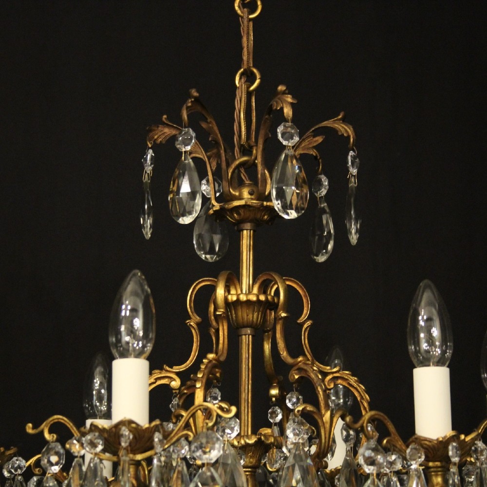 A six-light French gilded metal chandelier decorated with faceted crystal drops and hanging glass pendants. View IX
