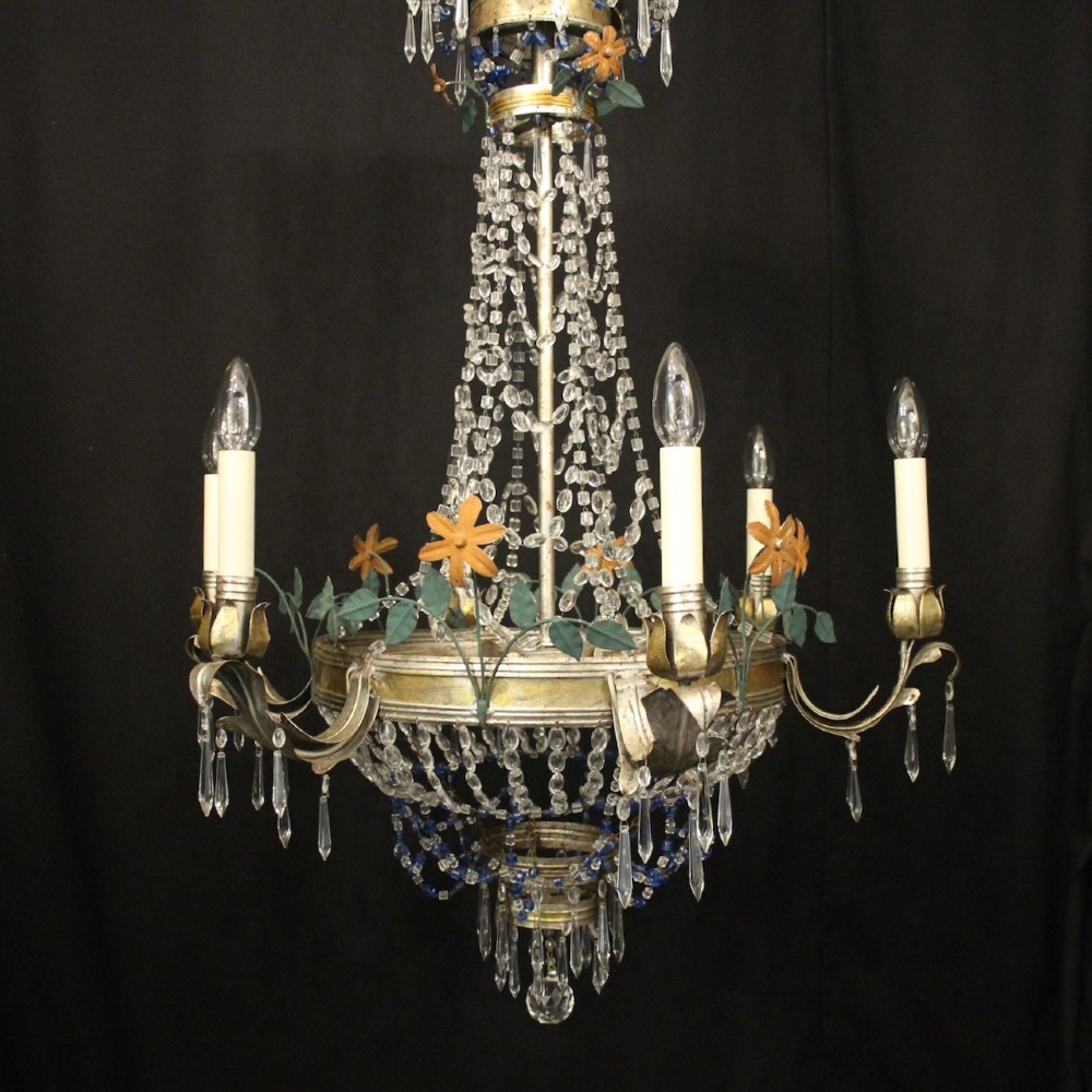A French tent and waterfall chandelier featuring a silver-gilded frame with floral accents, layered crystal bead strands, glass drops, and six candle light sockets. View II