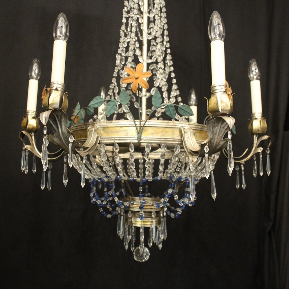 A French tent and waterfall chandelier featuring a silver-gilded frame with floral accents, layered crystal bead strands, glass drops, and six candle light sockets. View III