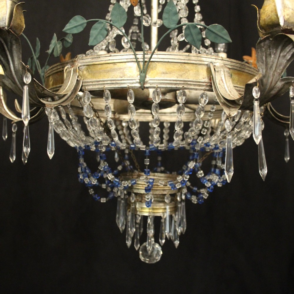 A French tent and waterfall chandelier featuring a silver-gilded frame with floral accents, layered crystal bead strands, glass drops, and six candle light sockets. View IV