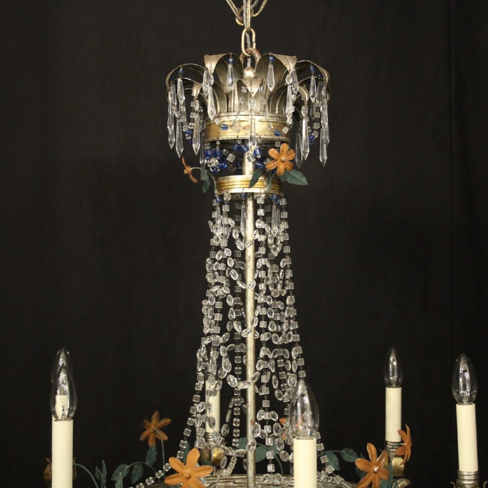 A French tent and waterfall chandelier featuring a silver-gilded frame with floral accents, layered crystal bead strands, glass drops, and six candle light sockets. View VI