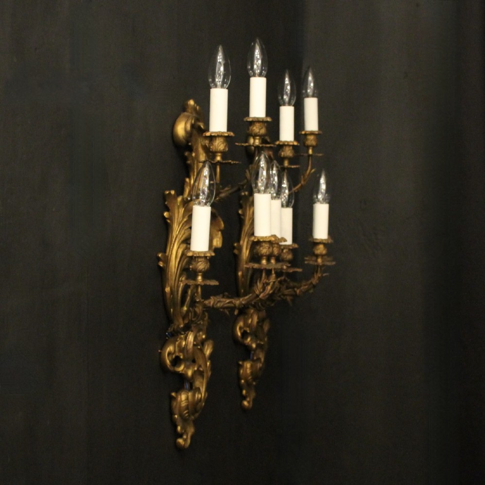 A pair of ornate French Rococo style gilded bronze five-arm wall sconces featuring acanthus leaf scrollwork. View X