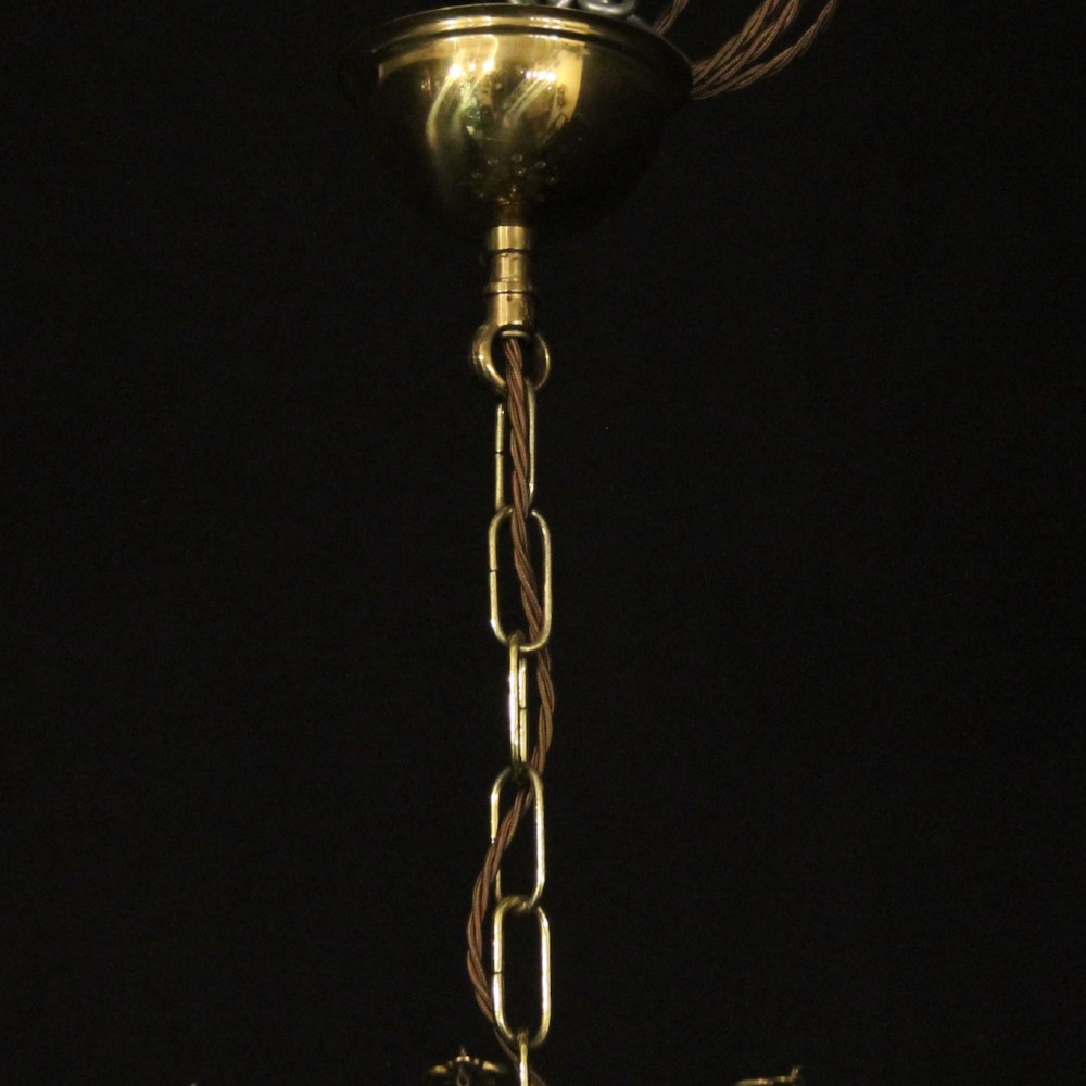 A French gilded brass fifteen-light waterfall chandelier featuring cascading crystal beads, a detailed metal gallery band, and radiating candle arms. View X