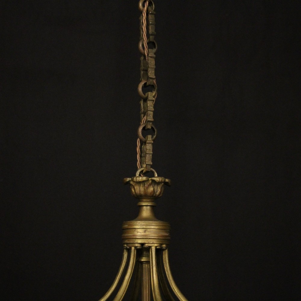 An English nineteenth-century gilded bronze four-light hall lantern with glazed glass panels and classical festoon ornamentation. View IX