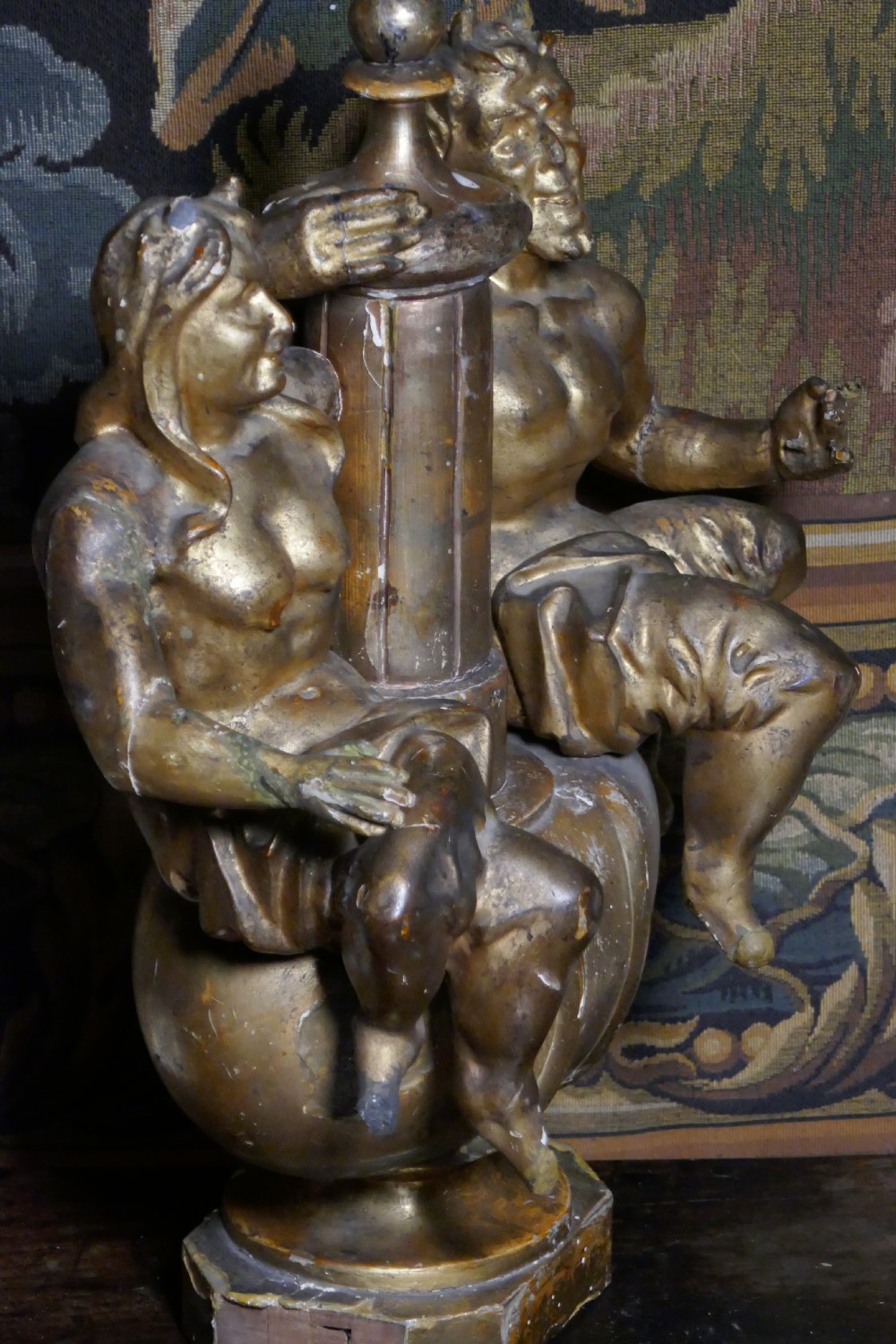 An 18th-century gilded carving featuring a central fluted column flanked by two seated mythological figures on an octagonal base. View XII