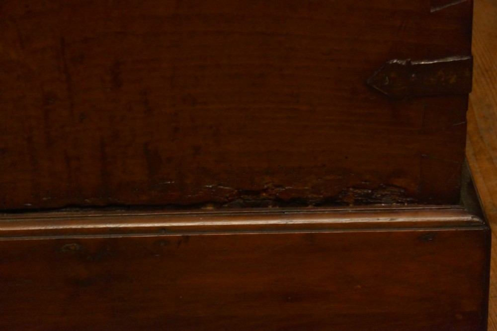 A dark oak 16th-century coffer featuring carved Gothic tracery panels and a central iron lock mechanism. View XVIII