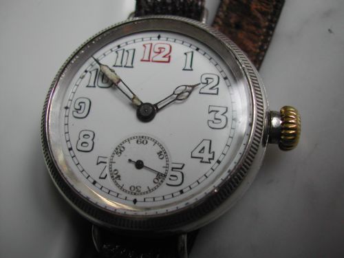 ww1 silver trench watch with screw front and back case for extra water proof protection circa 1915 - CATEGORY: ANTIQUE CLOCKS - DATED 1910
