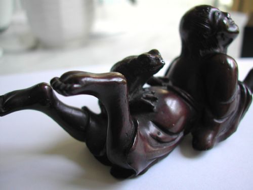 japanese bronze okimono of a reclining young man with a toad seated on his back dating to the meiji period - CATEGORY: ANTIQUE MISCELLANEOUS - DATED 1900