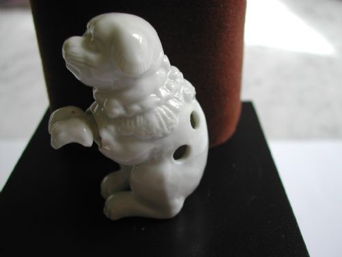 japanese hirado porcelain novelty netsuke of a seated puppy dating to the meiji period - CATEGORY: ANTIQUE CERAMICS - DATED 1900