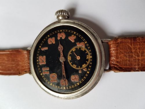 a fine ww1 black dial trench watch in a silver waterproof design screw front and back case dating to 1917 - CATEGORY: ANTIQUE WATCHES - DATED 1910