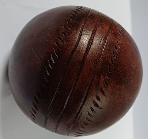 WOODEN SOLID WOOD CARVING OF A CRICKET BALL AS A DECK TOP ORNAMENT FOR THE MAN HAS EVERYTHING AND IS MAD ABOUT CRICKET PROBABLY MAHOGANY - ADDITIONAL PHOTO 4