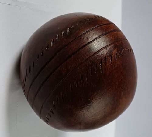 WOODEN SOLID WOOD CARVING OF A CRICKET BALL AS A DECK TOP ORNAMENT FOR THE MAN HAS EVERYTHING AND IS MAD ABOUT CRICKET PROBABLY MAHOGANY - ADDITIONAL PHOTO 5