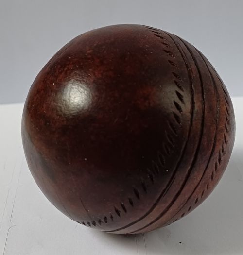 WOODEN SOLID WOOD CARVING OF A CRICKET BALL AS A DECK TOP ORNAMENT FOR THE MAN HAS EVERYTHING AND IS MAD ABOUT CRICKET PROBABLY MAHOGANY - ADDITIONAL PHOTO 6