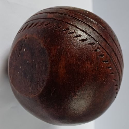 WOODEN SOLID WOOD CARVING OF A CRICKET BALL AS A DECK TOP ORNAMENT FOR THE MAN HAS EVERYTHING AND IS MAD ABOUT CRICKET PROBABLY MAHOGANY - ADDITIONAL PHOTO 9
