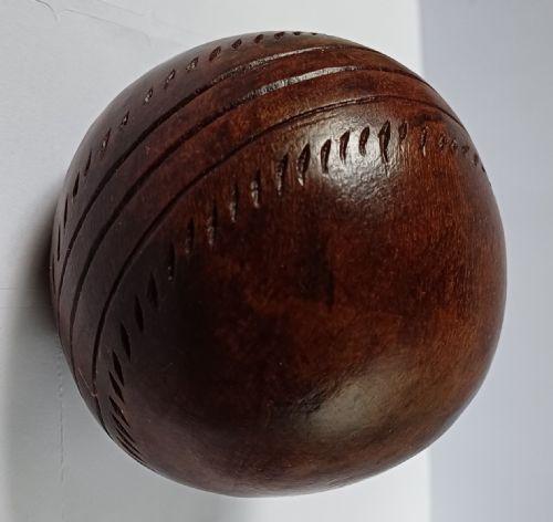 WOODEN SOLID WOOD CARVING OF A CRICKET BALL AS A DECK TOP ORNAMENT FOR THE MAN HAS EVERYTHING AND IS MAD ABOUT CRICKET PROBABLY MAHOGANY - ADDITIONAL PHOTO 12