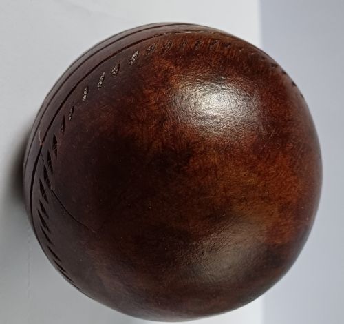 WOODEN SOLID WOOD CARVING OF A CRICKET BALL AS A DECK TOP ORNAMENT FOR THE MAN HAS EVERYTHING AND IS MAD ABOUT CRICKET PROBABLY MAHOGANY - ADDITIONAL PHOTO 13