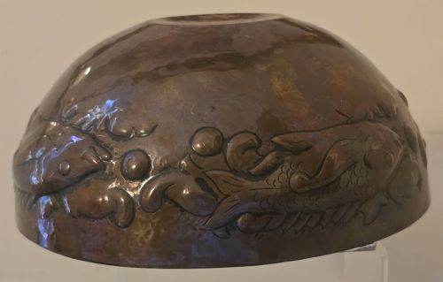 fig 4. A hand-hammered dark copper rose bowl featuring embossed fish motifs and a pierced top lid.