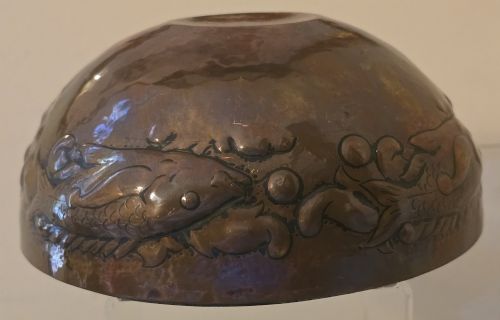 fig 6. A hand-hammered dark copper rose bowl featuring embossed fish motifs and a pierced top lid.