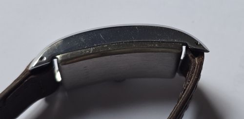 fig 10. A 1940s rectangular gents mechanical tank watch with a silver-tone case, cream dial featuring printed Arabic numerals and a sub-seconds dial, finished with a brown leather strap.