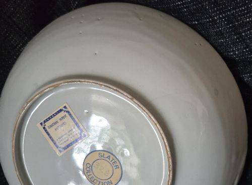 fig 3. An eighteenth-century circular English delftware saucer dish painted with a cobalt blue dragon motif on a white tin glaze.