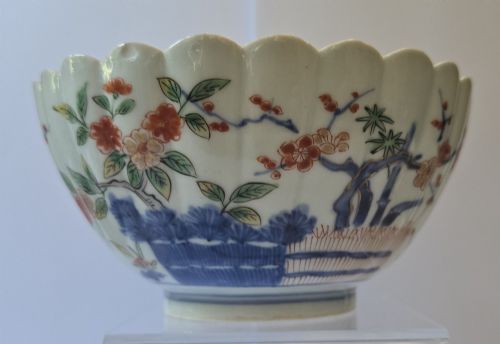 fig 5. A fluted late 17th-century Japanese porcelain bowl decorated with polychrome floral enamel motifs against an off-white background.