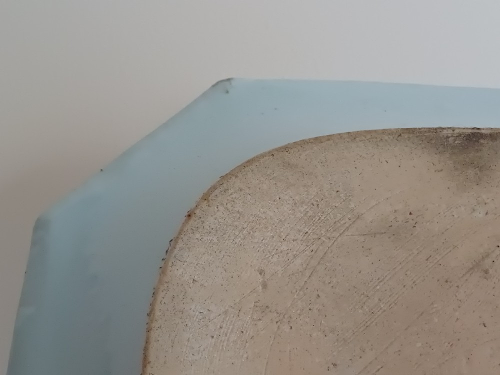 An 18th-century octagonal Chinese porcelain dish decorated with a central heraldic crest and colourful floral enamel sprays along the border. View VII