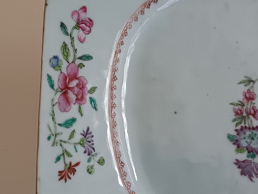 An 18th-century octagonal Chinese porcelain dish decorated with a central heraldic crest and colourful floral enamel sprays along the border. View XIII